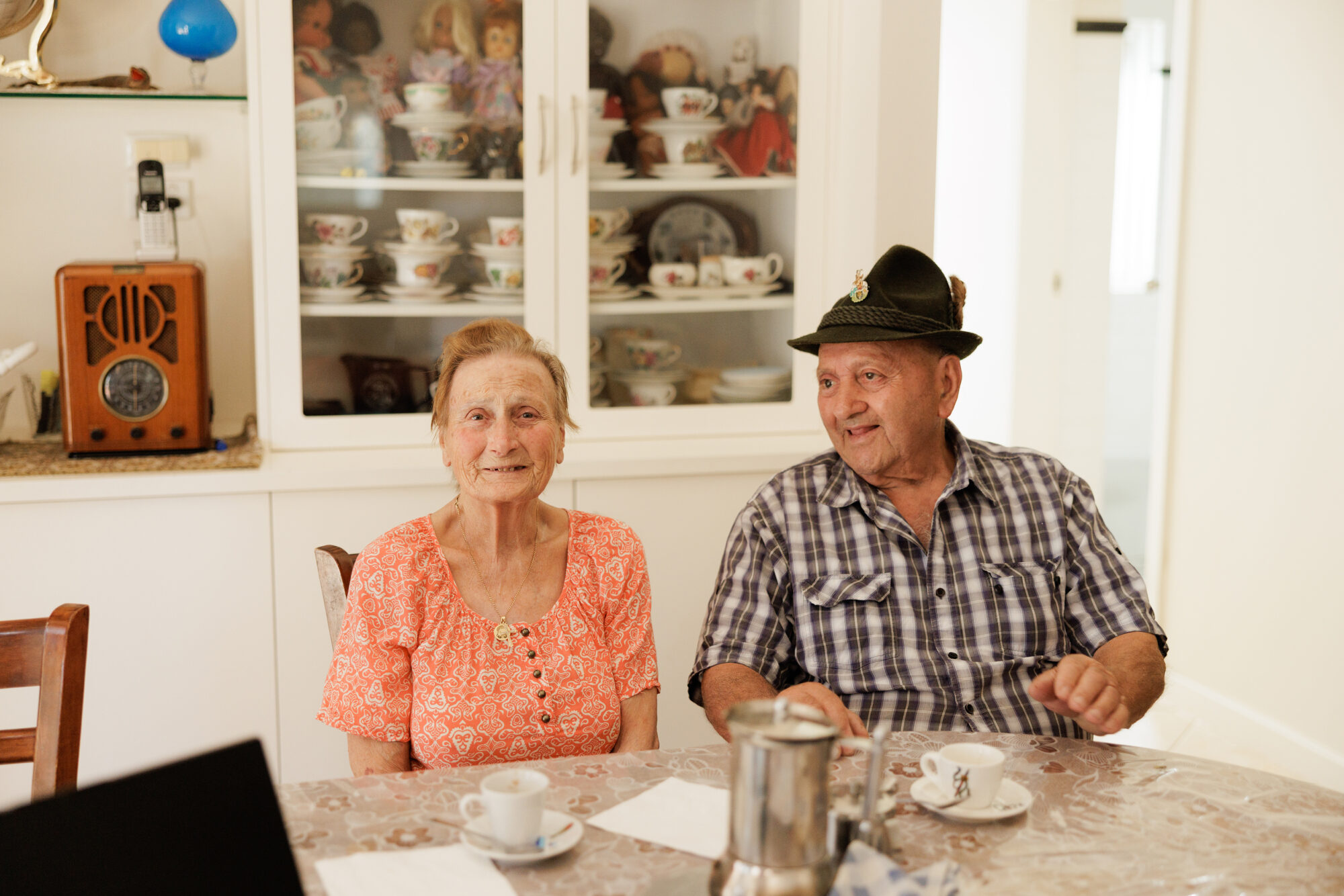 An older couple together at home.